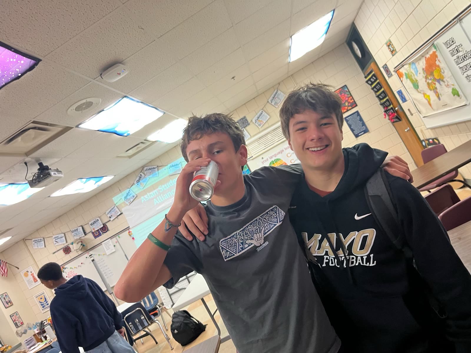 Two friends posing together at a meeting